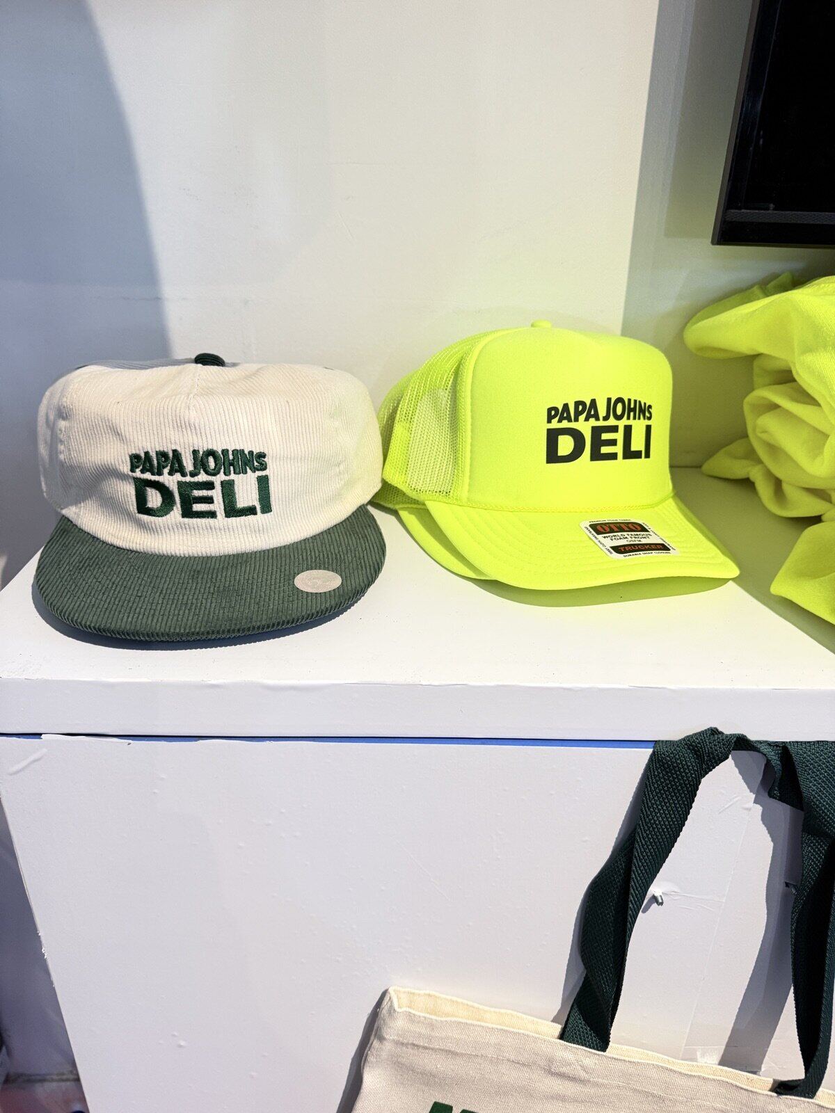 Display of finished custom apparel and keepsakes