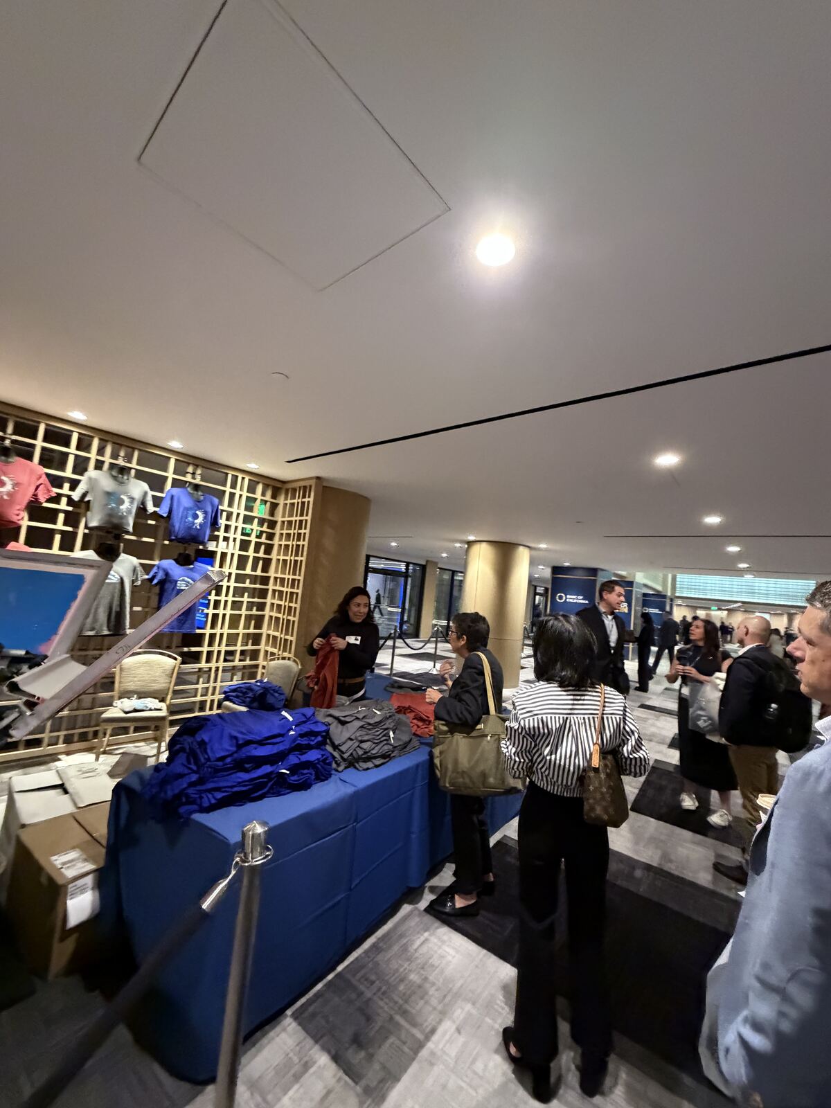 Indoor event with people walking through the venue